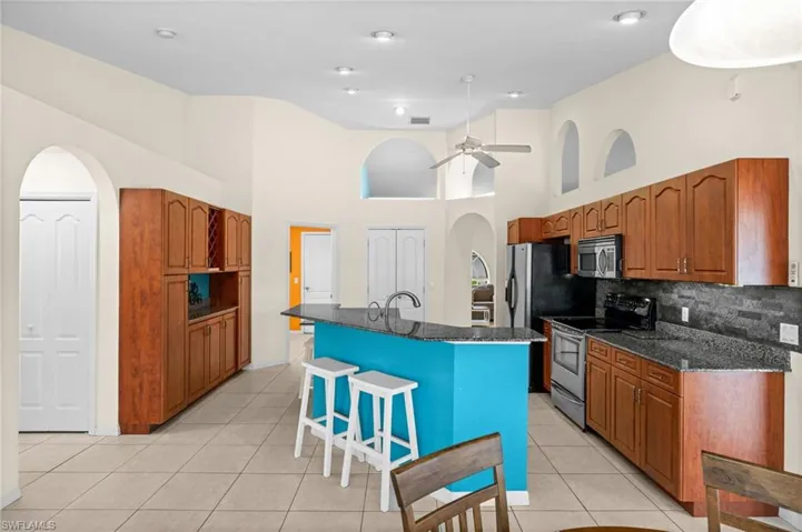 Countertop seating, an added bonus. Behind the double doors ... a large pantry.