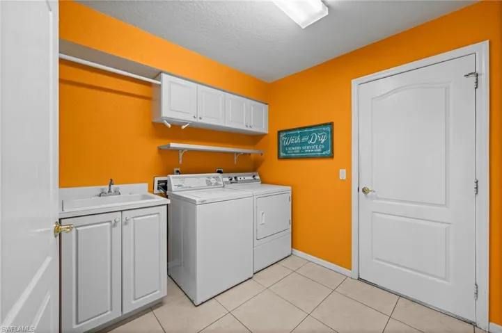 Bright. Cheerful. Conveniently located; providing additional storage and a laundry tub.