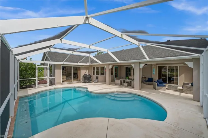 A heated freeform pool. A large under truss lanai. And; pocket sliders across the rear of the home!