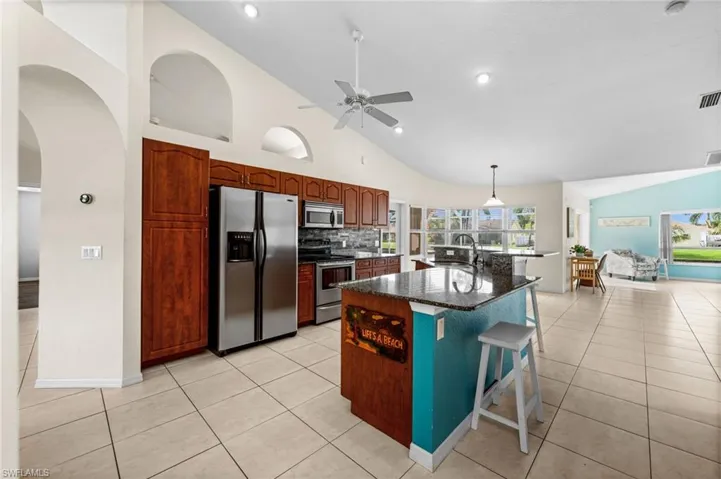 Stainless appliances and a decorative backsplash.