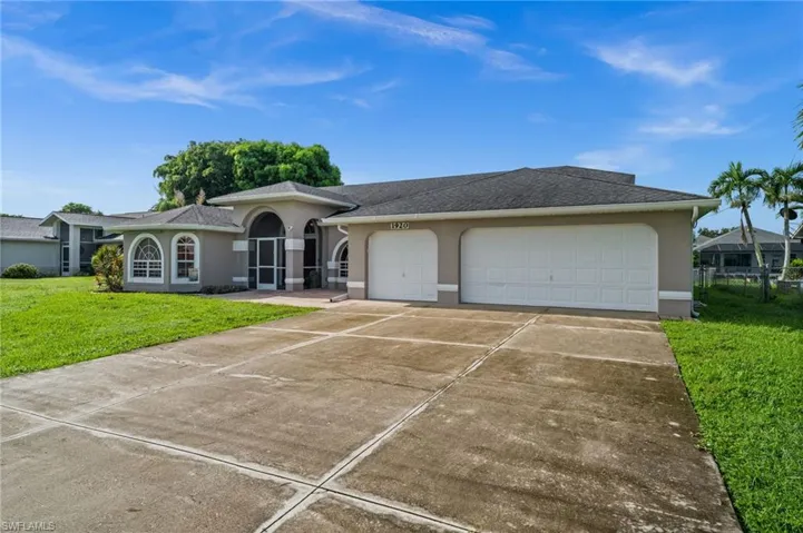 Not a cookie-cutter home! Great roof lines and nice accents.