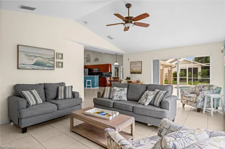 Sliders conveniently lead to the oversized lanai and heated pool.