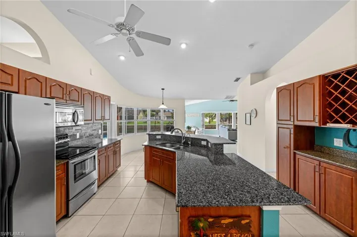 The granite glistens. The wood cabinetry; beautifully maintained.