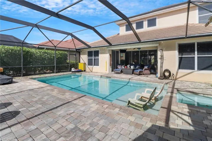 View of pool with a patio, a lanai, and an outdoor hangout area