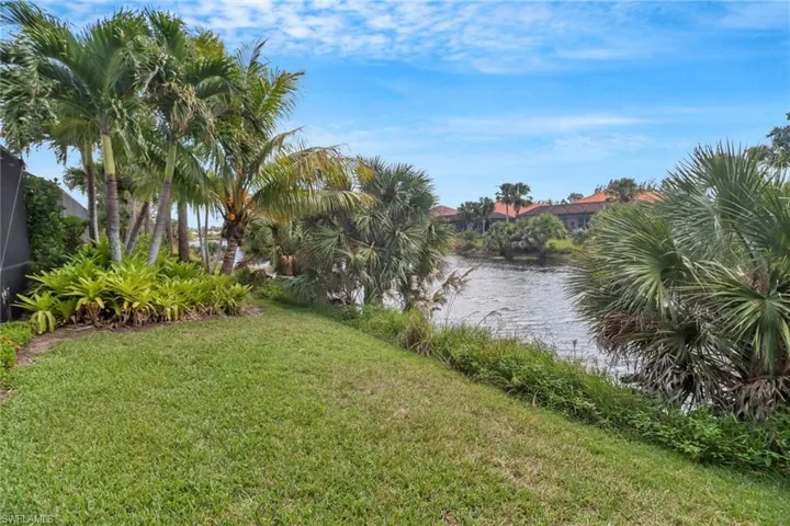 View of yard with a water view