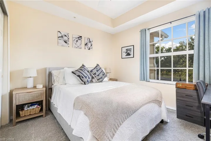 Carpeted bedroom featuring baseboards
