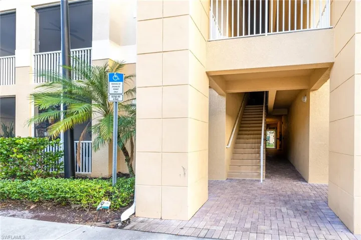 Entrance to property with stucco siding