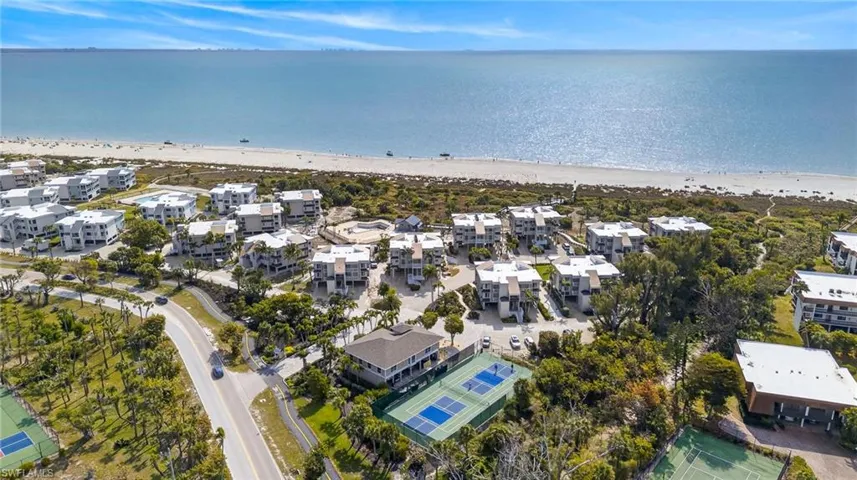 Aerial view of waterfront with a beach