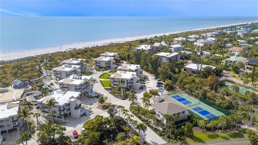 Aerial perspective of suburban area with expansive beach