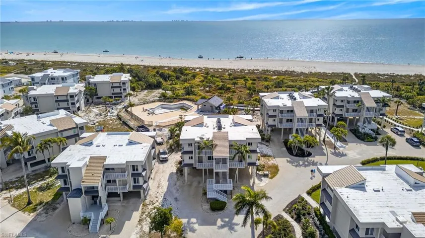 Aerial view of expansive beach and apartment complex