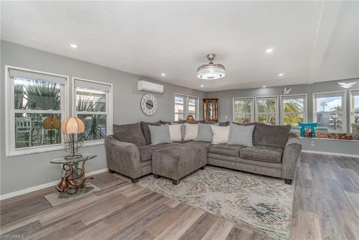 GREAT ROOM W/EASTERN, SOUTHERN AND WESTERN EXPOSURE WINDOWS.  WOOD-LOOK PLANK TILE FLOORING THROUGHOUT.  RECESSED LIGHTING.
