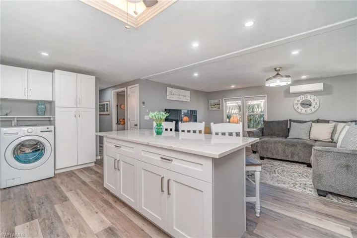 SPACIOUS ISLAND W/STORAGE.  LARGE PANTRY CABINET.  RECESSED LIGHTING THROUGHOUT MAIN LIVING AREA.