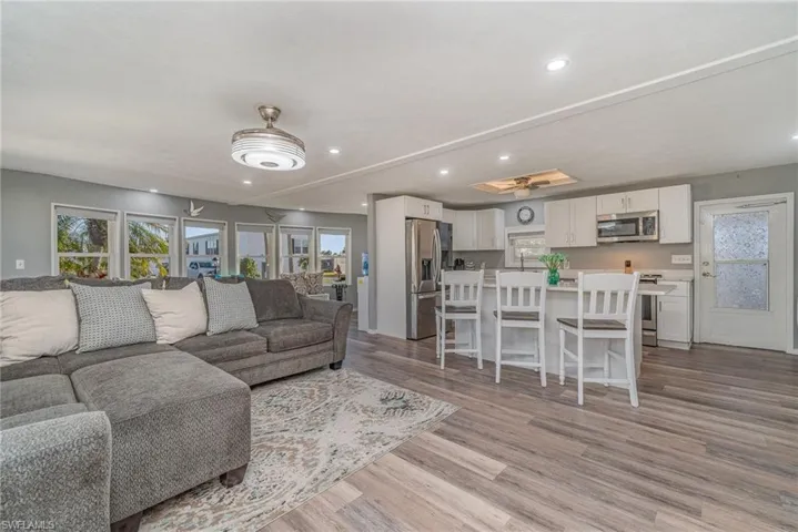 GREAT ROOM SHOWING 6 SOUTHERN EXPOSURE BAY WINDOWS