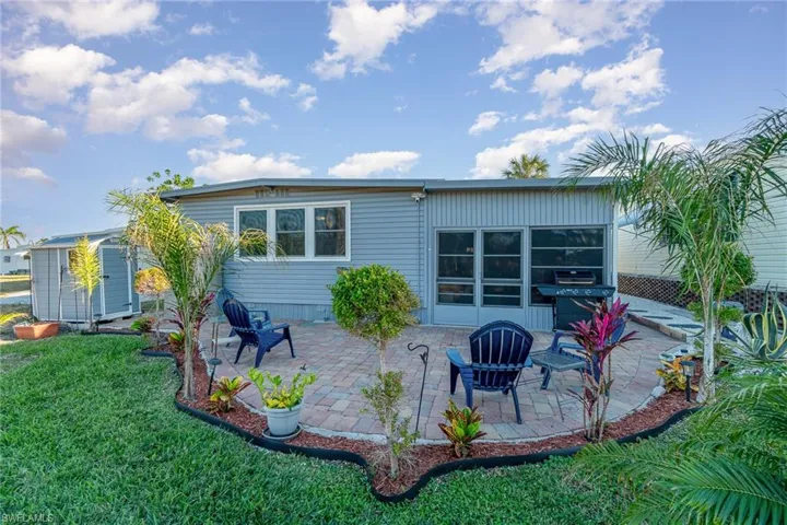 NICELY LANDSCAPED YARD AND PAVERED PATIO.  SEPARATE STORAGE SHED.