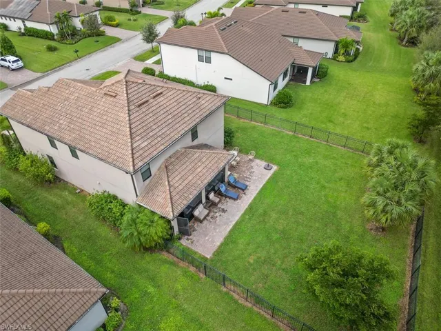 Large fenced backyard with pavered patio