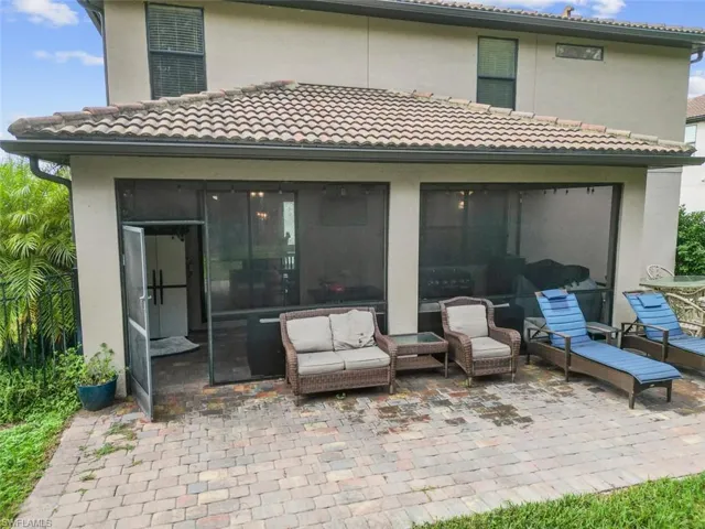 Covered, screened lanai with wavered patio