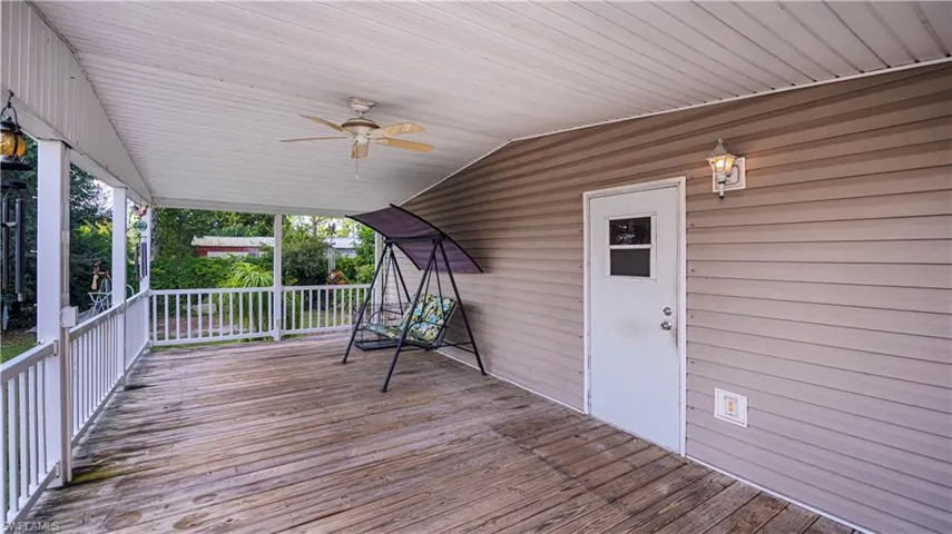 Wooden deck featuring ceiling fan