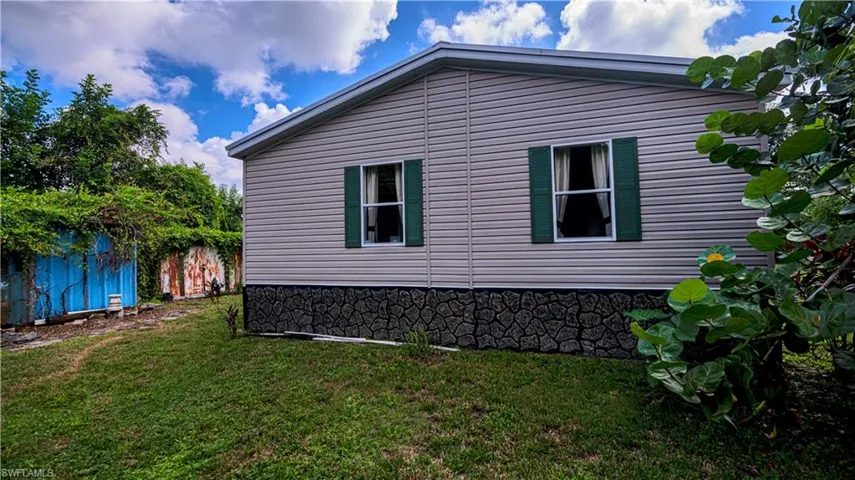 View of home's exterior featuring a lawn