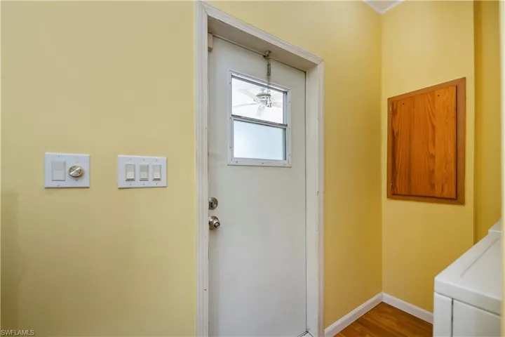 Doorway featuring hardwood / wood-style floors
