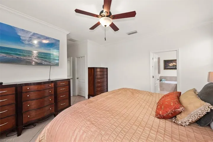 Primary bedroom with direct access to the en-suite bathroom.