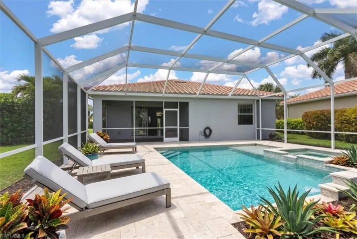 Virtually Staged PoolPrivacy landscaping and side spacing enhance the home's private feel.