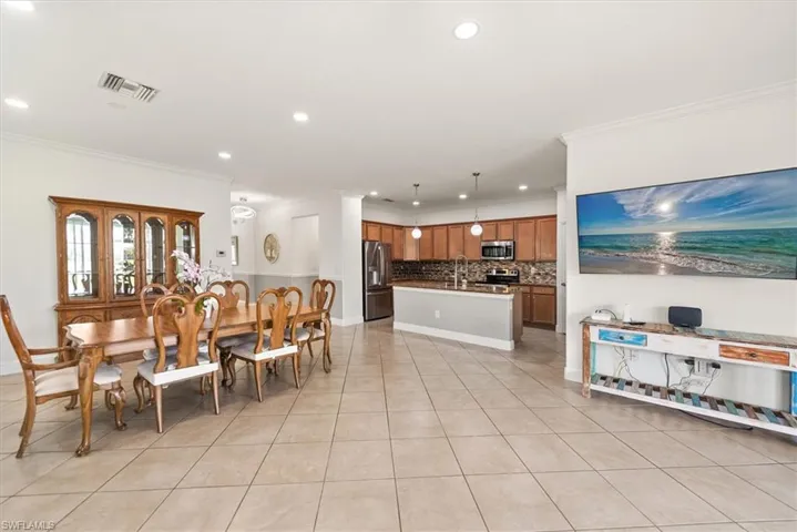 Dining area positioned near the kitchen with a comfortable connection to the main living area.
