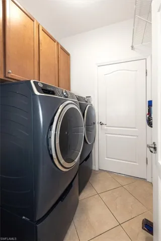 Laundry and utility area with convenient access to the garage.