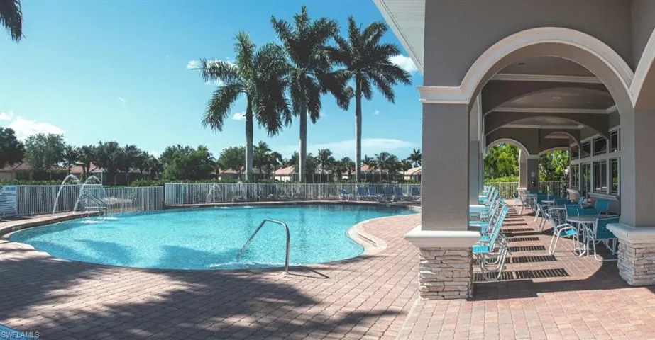 Resort style community pool with water features and lounge areas