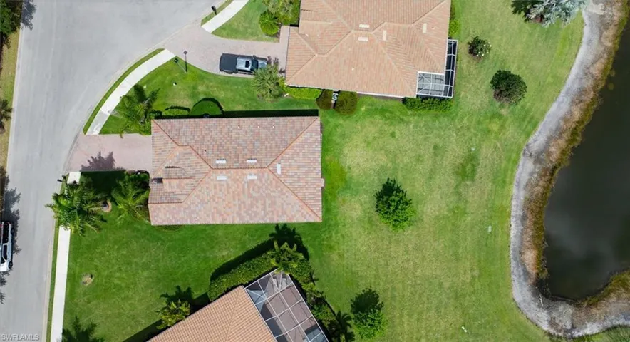 Rooftop aerial showcasing the expansive home site and unique lot position.