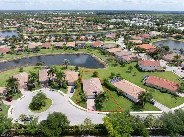 Aerial view with property outlined in red, showing the cul-de-sac setting and added spacing from neighboring homes for added privacy.