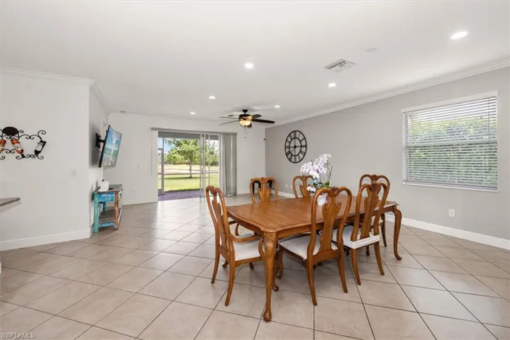Dining area with a view through the living room to the lanai.