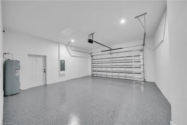 Garage with electric water heater and electric panel