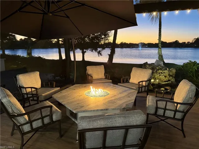 View of patio / terrace featuring a fire pit and a water view