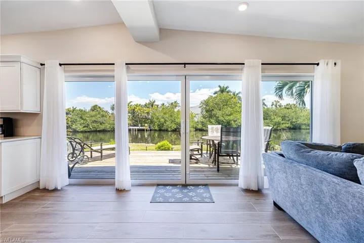 Living Room with double sliders and River View