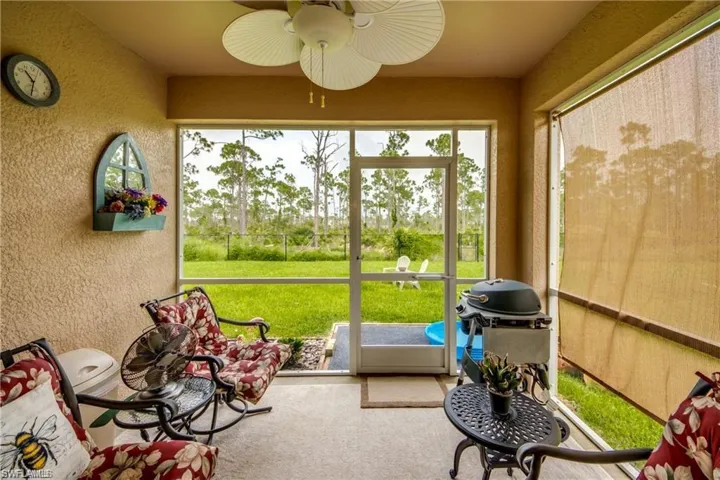 Sunroom featuring ceiling fan