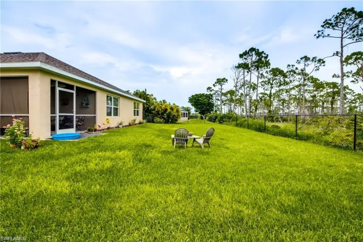 View of yard featuring a sunroom