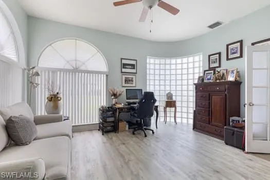 Office space featuring light wood-type flooring and ceiling fan