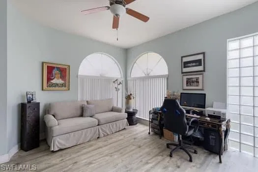 Office area featuring wood finished floors and ceiling fan