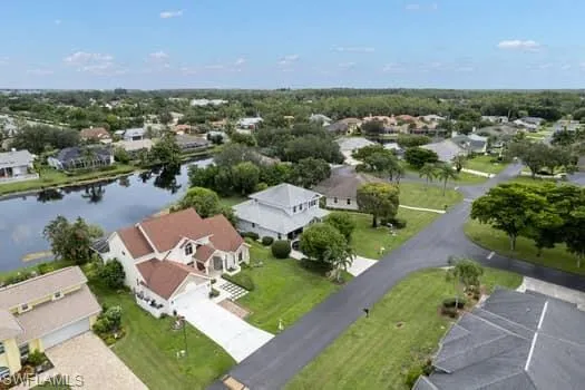 Aerial perspective of suburban area with a large body of water