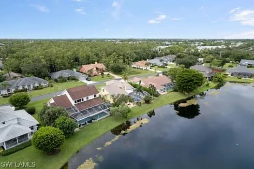 Aerial view of residential area featuring a large body of water