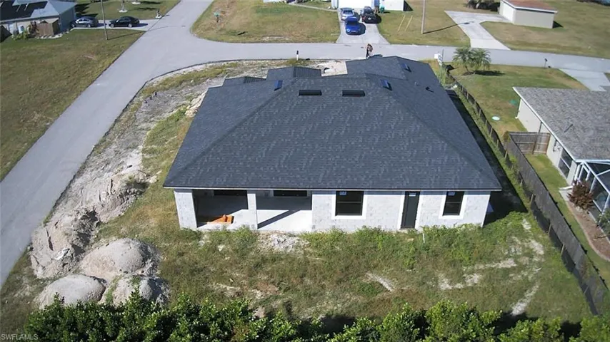 Aerial overview of property's location featuring nearby suburban area