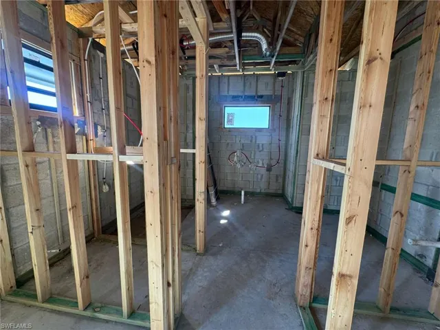 Misc room with unfinished concrete floors