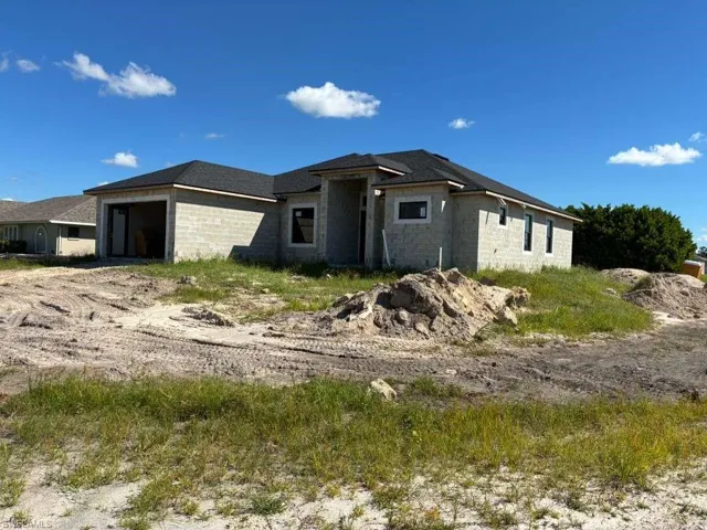 View of front of property featuring a garage