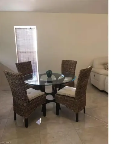 Dining area featuring light tile patterned floors