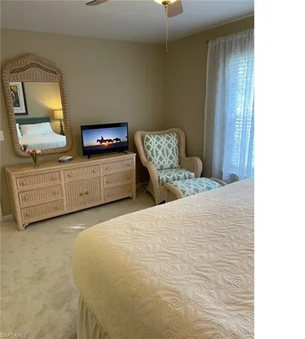 Bedroom featuring carpet flooring and a ceiling fan