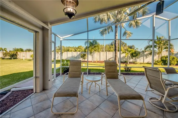 Huge Lanai with extended screen cage.  BEAUTIFULLY TILED