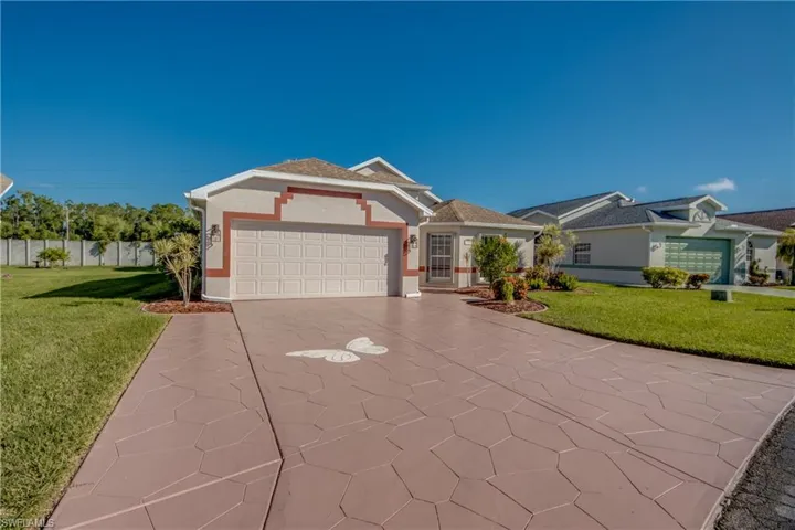 Large two car garage with oversized driveway.