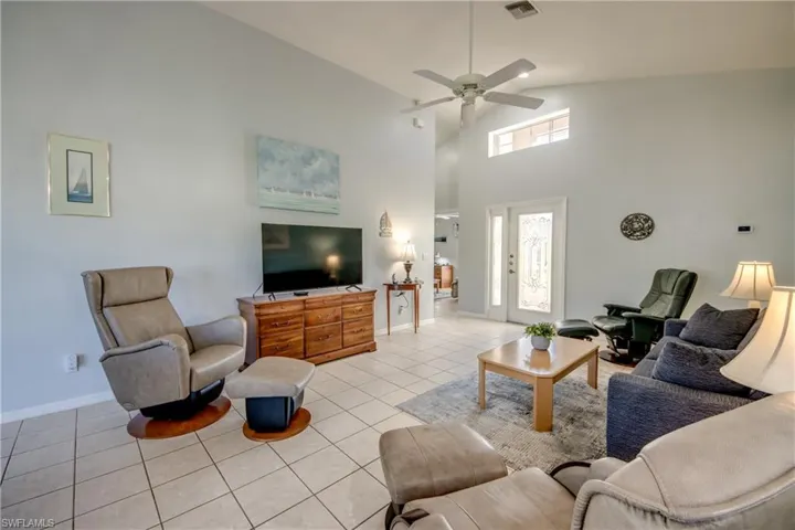 Great room looking to guest quarters. NOTE THE TILE FLOORS THRU OUT THE HOME.