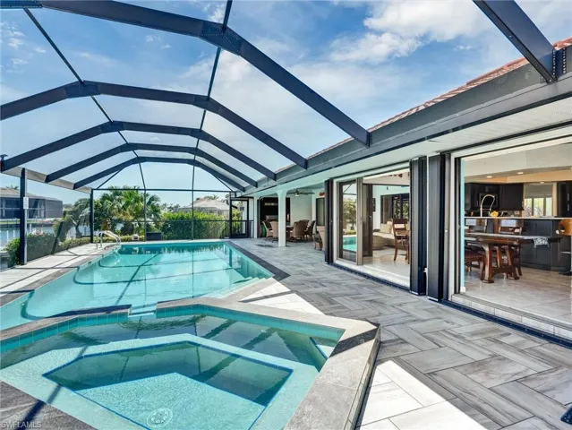 Just a few steps for the lanai to your pool & spa