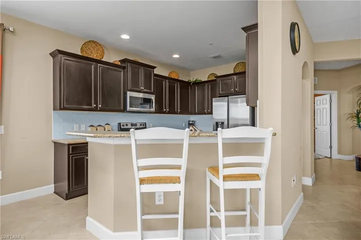 Open Kitchen with breakfast bar and family dining area for more formal meals.